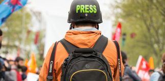 A reporter at a protest.